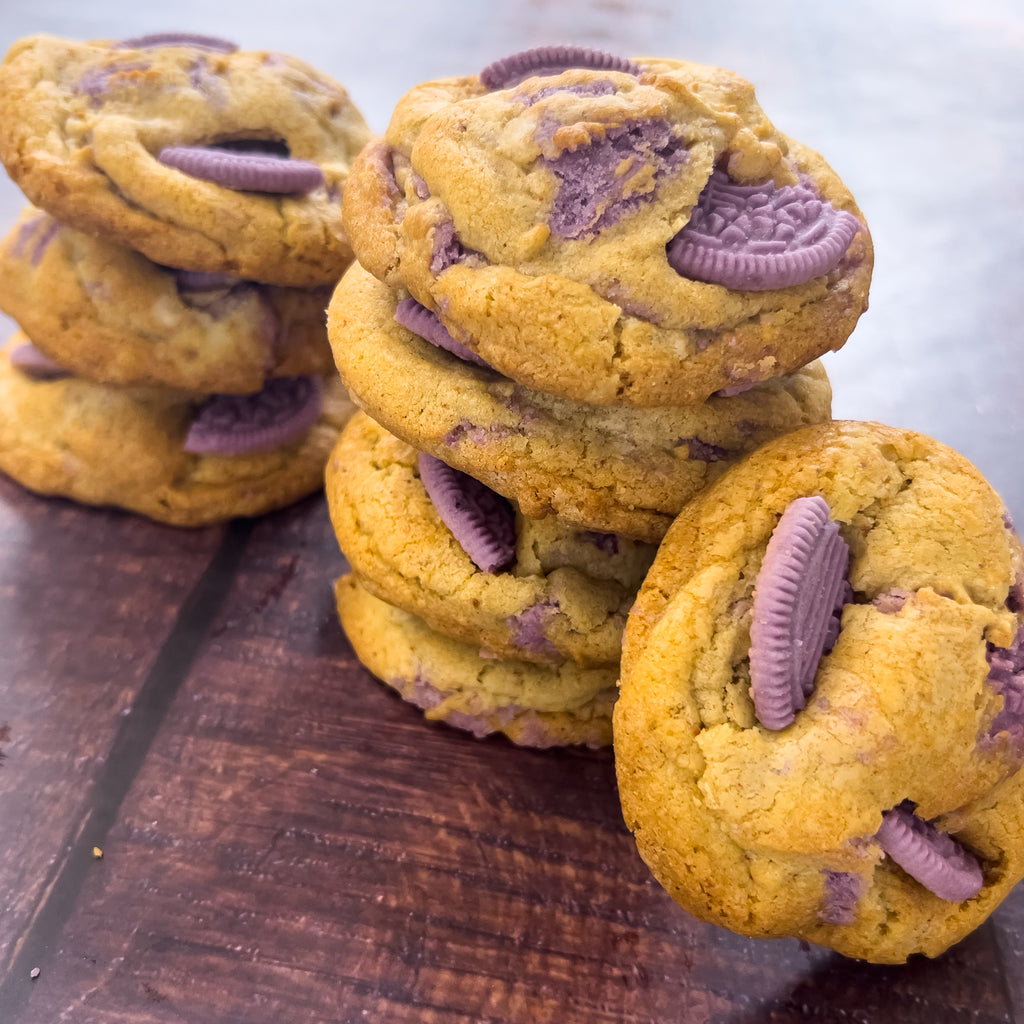 BTS Cookies on a board, purple Oreo halves pressed into the tops